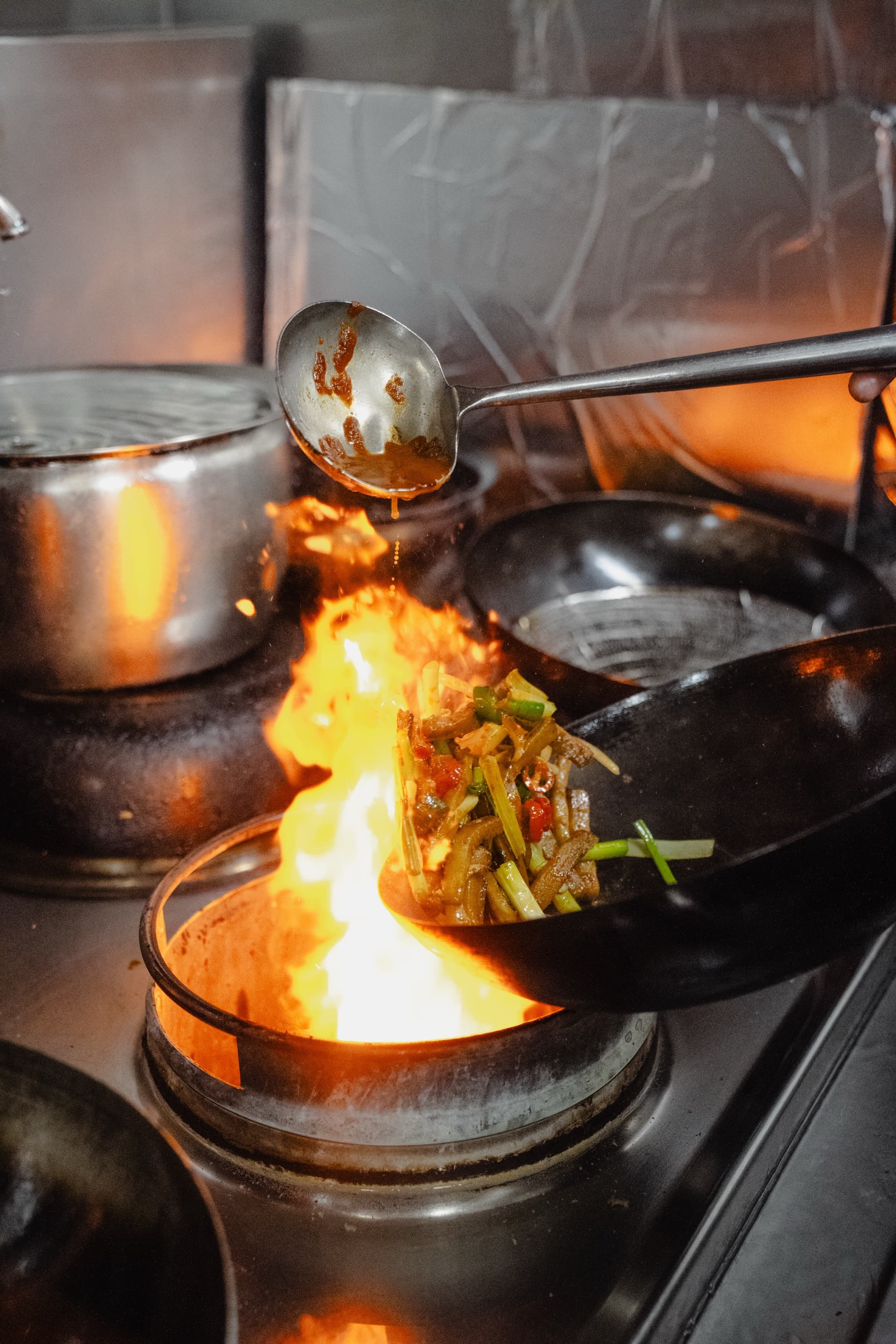 Wok flames in The Greedy Sheep kitchen